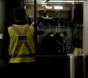 Police restrain Robert Dziekanski